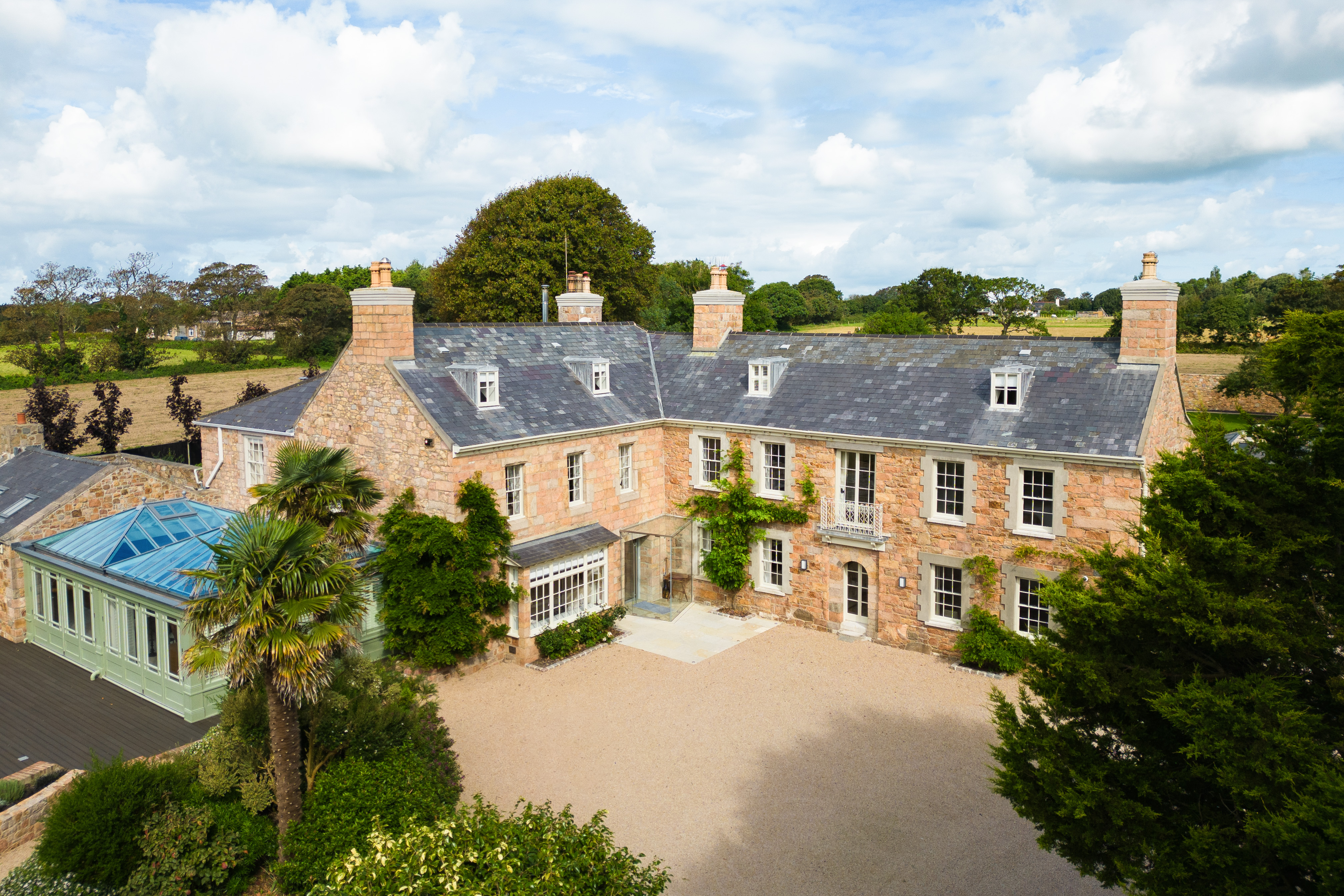 Jersey granite country house with a glass conservatory