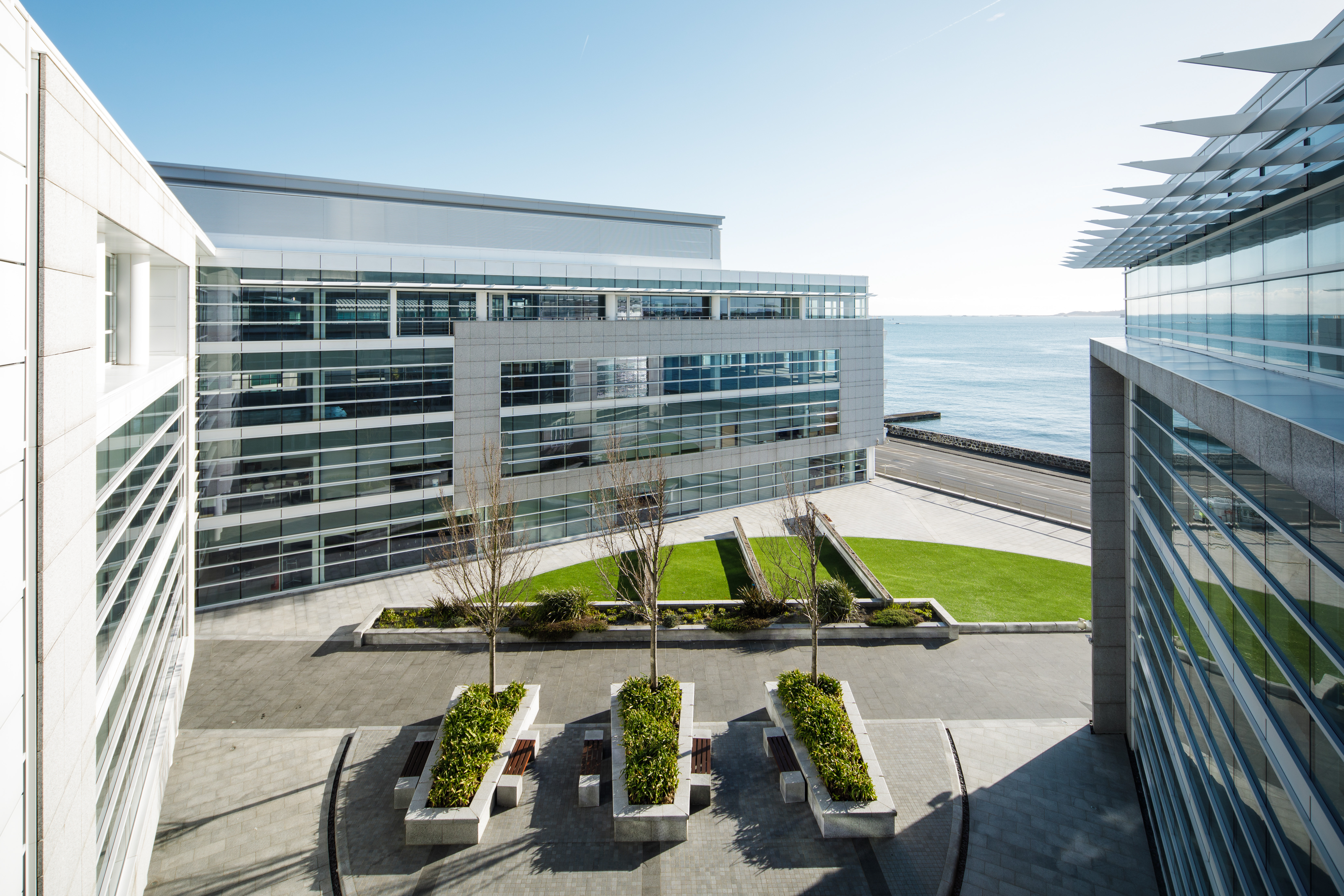 Square office building in Admiral Court, Guernsey with a sea view